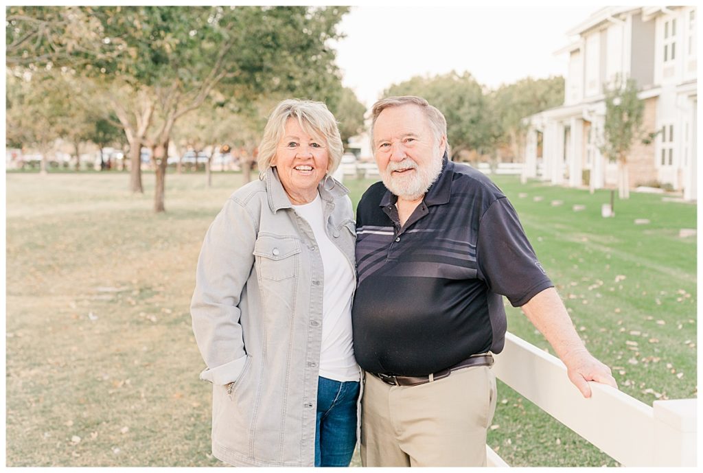 Couples Photos green grass, trees and white picket fences