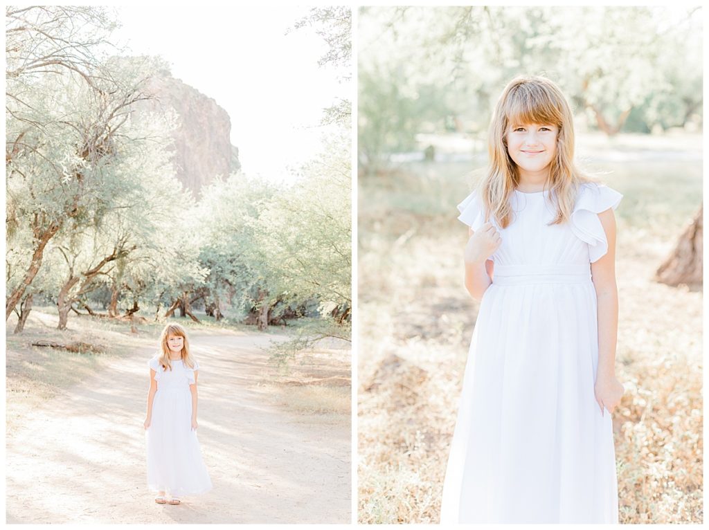 girl in a white dress walking down a path at coons bluff