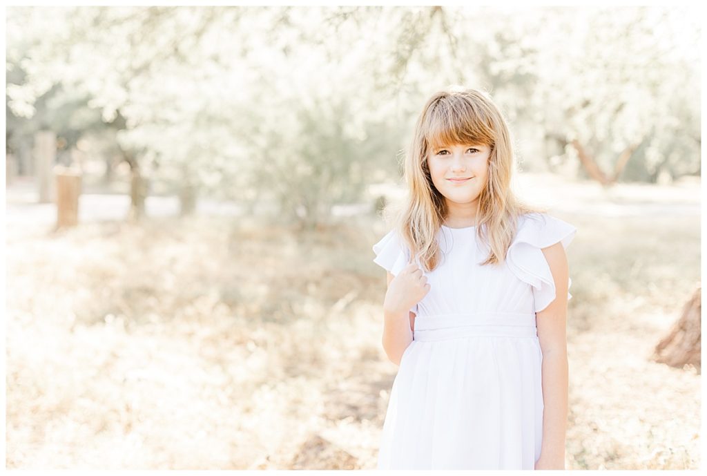 Dreamy Coons Bluff Session, girl in a white dress standing and smiling