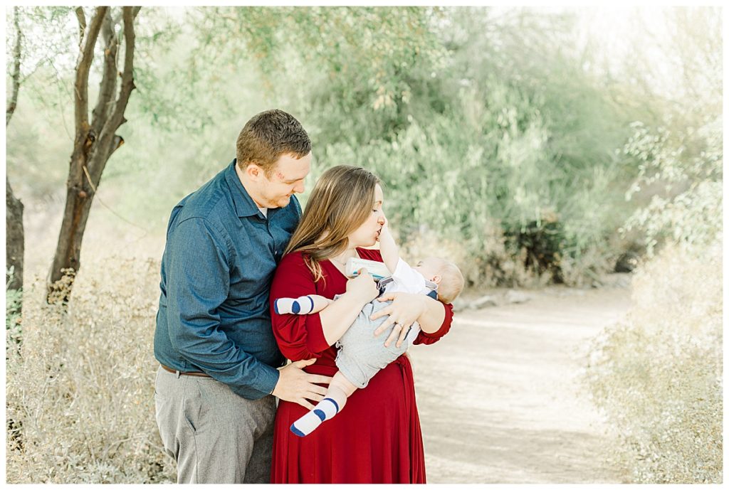 mom and dad giving baby at bottle at Veterans Oasis 