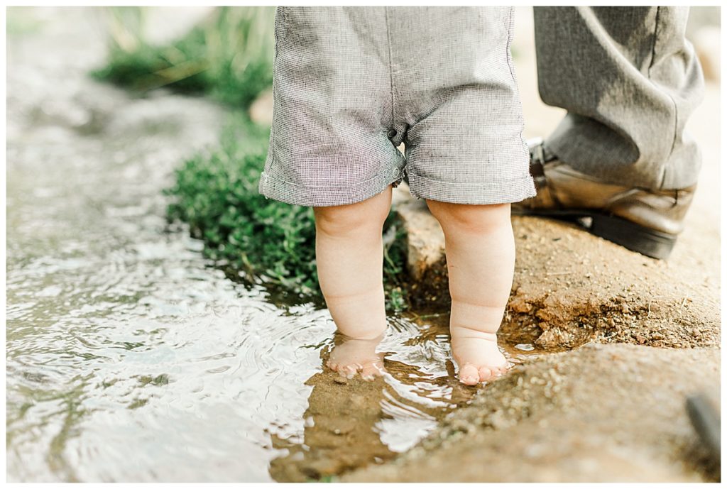 little boys toes standing in a creek at Veterans Oasis