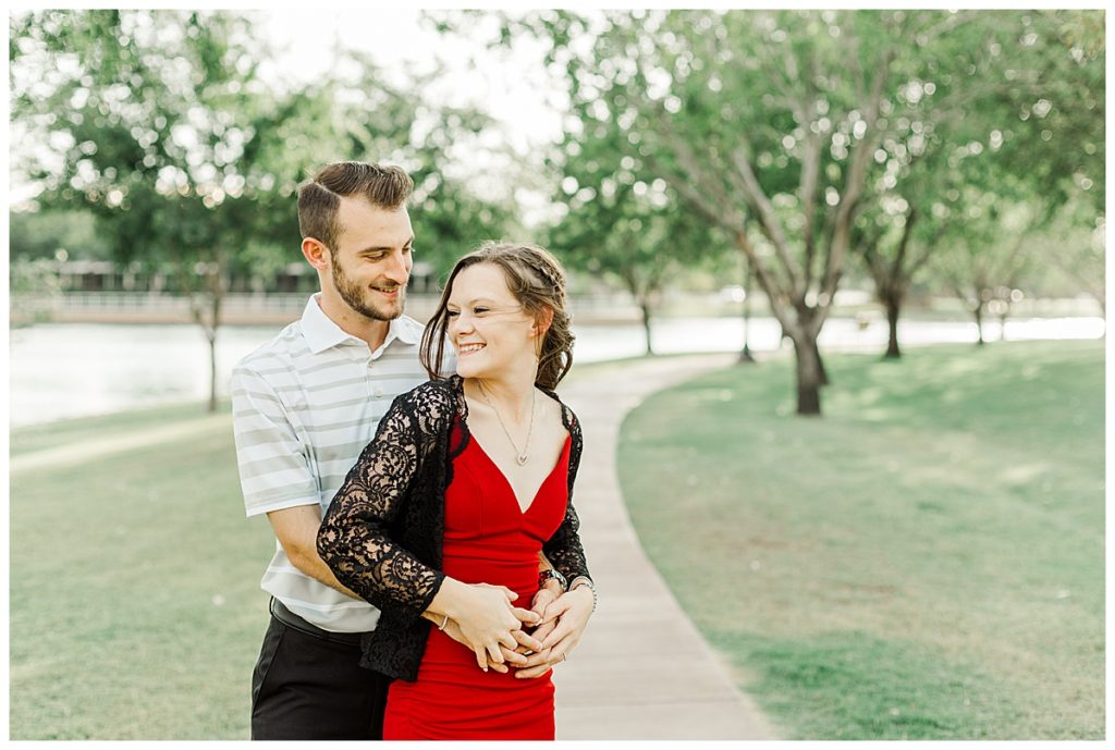 Couple laughing with each other on sidewalk at Morrison Ranch