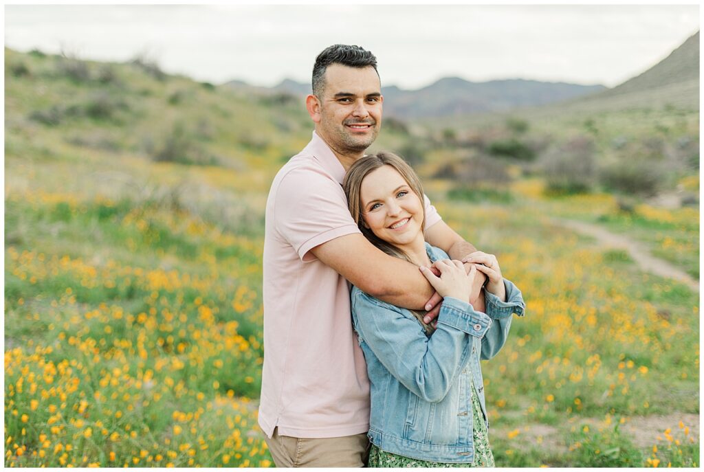 Husband and wife portraits standing in a field of wildflowers at bush highway spring desert photos 