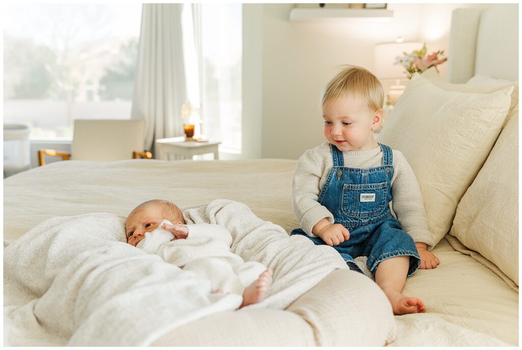 toddler meeting her newborn little brother | Gilbert, Arizona In-home Newborn Session