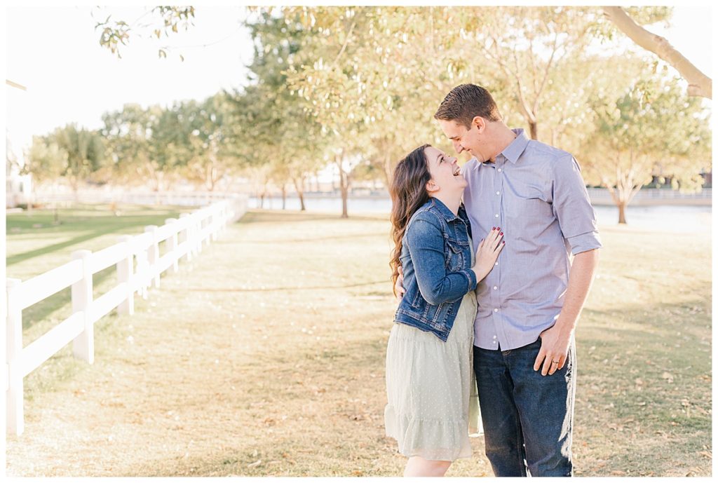 Couples photos at Morrison Ranch,  standing under big green trees next to white picket fences