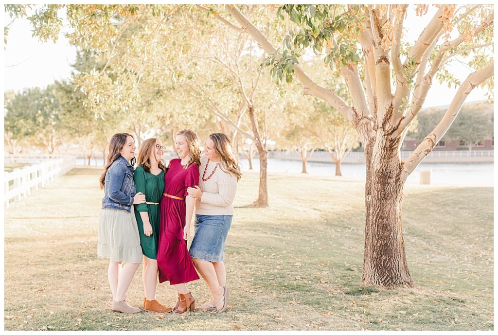 Morrison Ranch Family Photos, under big green trees with a white picket fence near a lake