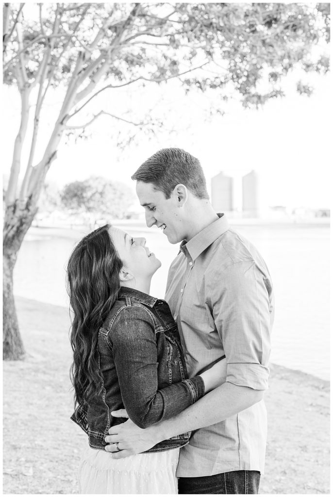 Couples photos at Morrison Ranch near a lake, a big tree, and the four silos in the background