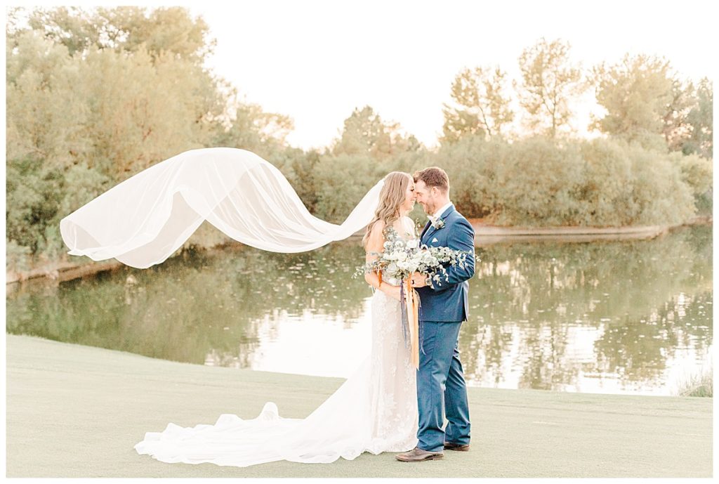 Flying veil shot of a newly married couple at the Raven Golf Course | What makes a veil fly?