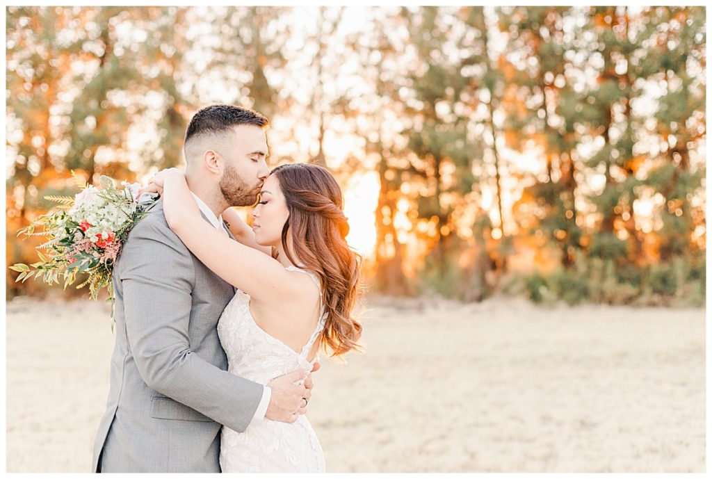Romantic Bridal portraits in a field with pine trees at Schneff Farms