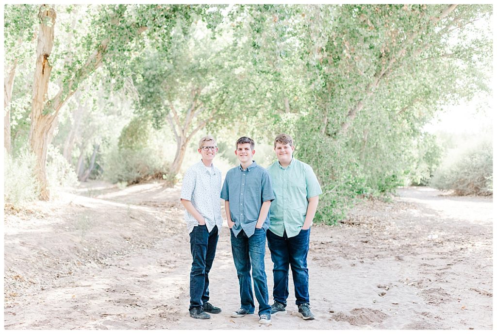 Ison's family photos, 3 boys standing together under big trees at queen creek wash