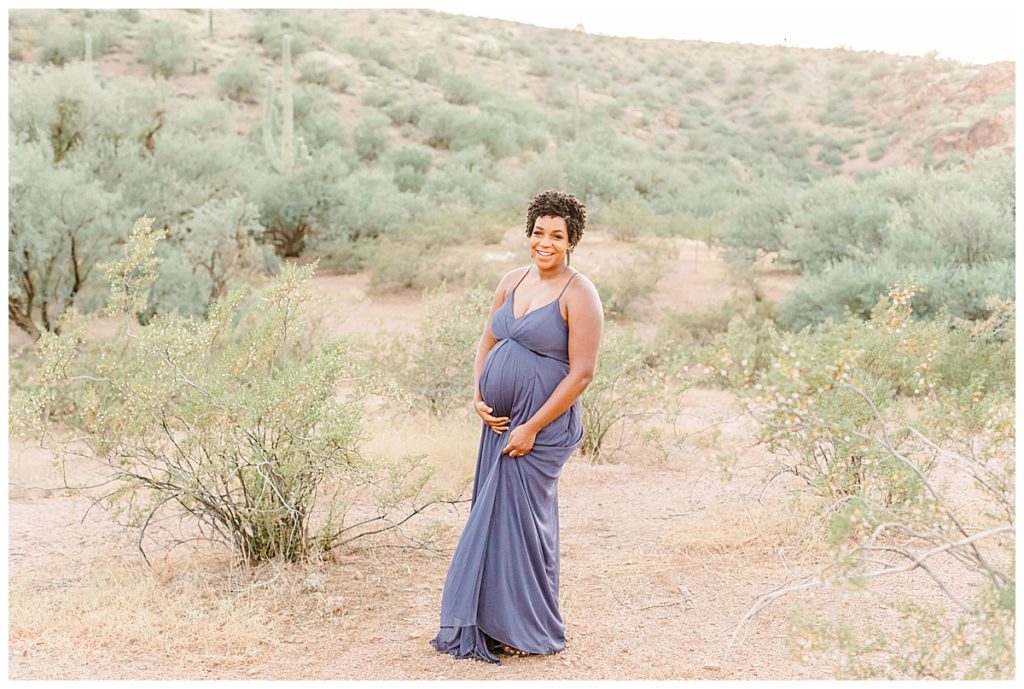 pregnant women wearing a long purple dress standing in coons bluff