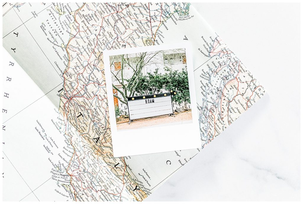 a polaroid photo laying on a map, ways to enjoy your photos more
