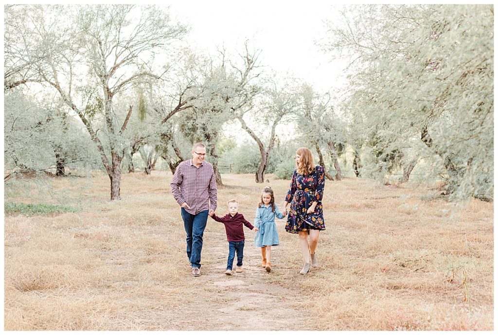 Thiel's family photos | Family walking down dirt path at Coons Bluff