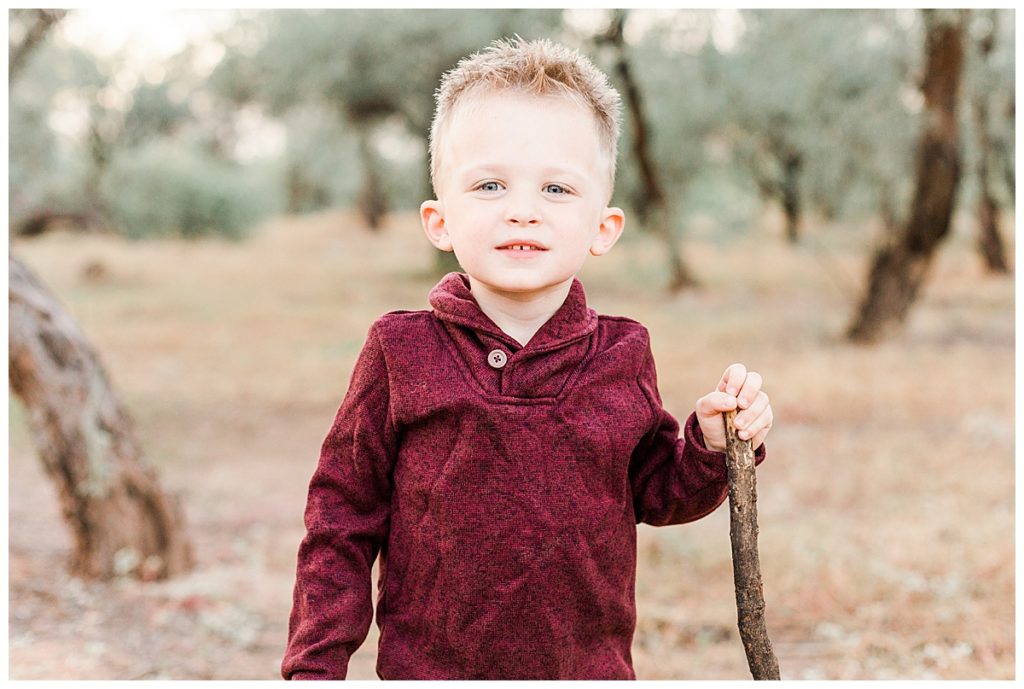 Little boy holding a stick at Coons Bluff, Gilbert Arizona Family Photos, How to Get Your Kids Excited for Photos