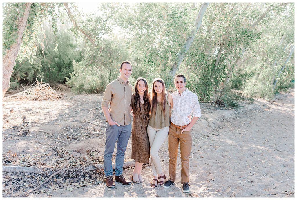 Four siblings smiling together | Grondin Family Photos | Queen Creek Wash | Arizona Family Session
