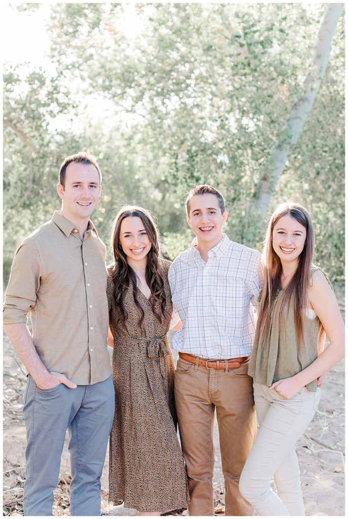 Four siblings smiling together | Grondin Family Photos | Queen Creek Wash | Arizona Family Session