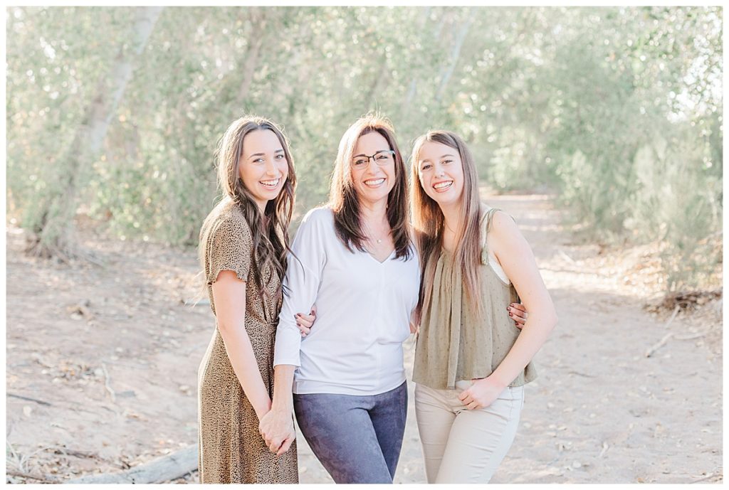 Mom laughing with her two daughters | Grondin Family Photos | Queen Creek Wash, Arizona Family Session