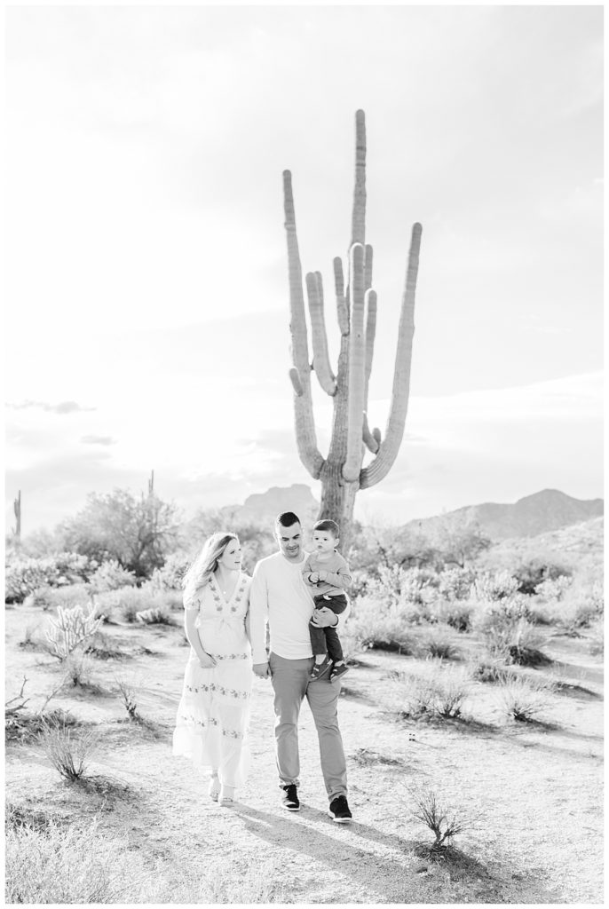 Black and white photo of the Sanchez family walking though the desert at Coons Bluff 