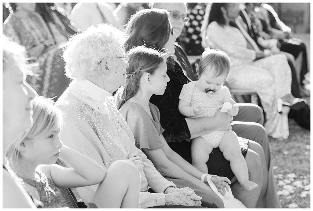 Black and white of Grandma and Baby at Candice & Joel's Private Estate Scottsdale Wedding Ceremony