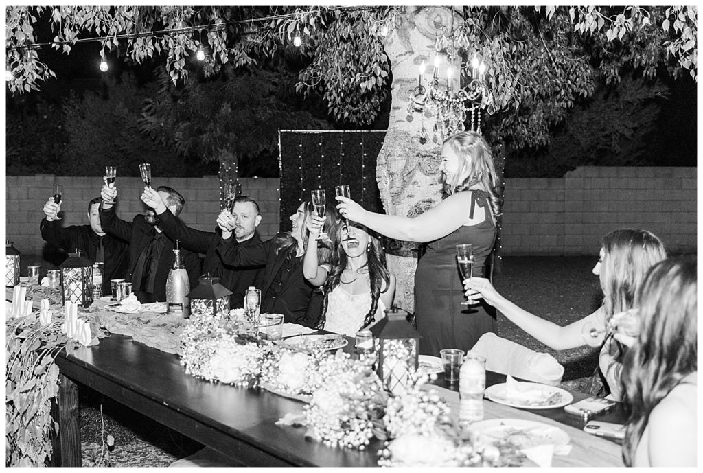 Black and White Photo of Maid of Honor giving toast at Candice and Joel's Private Estate Scottsdale Wedding and reception