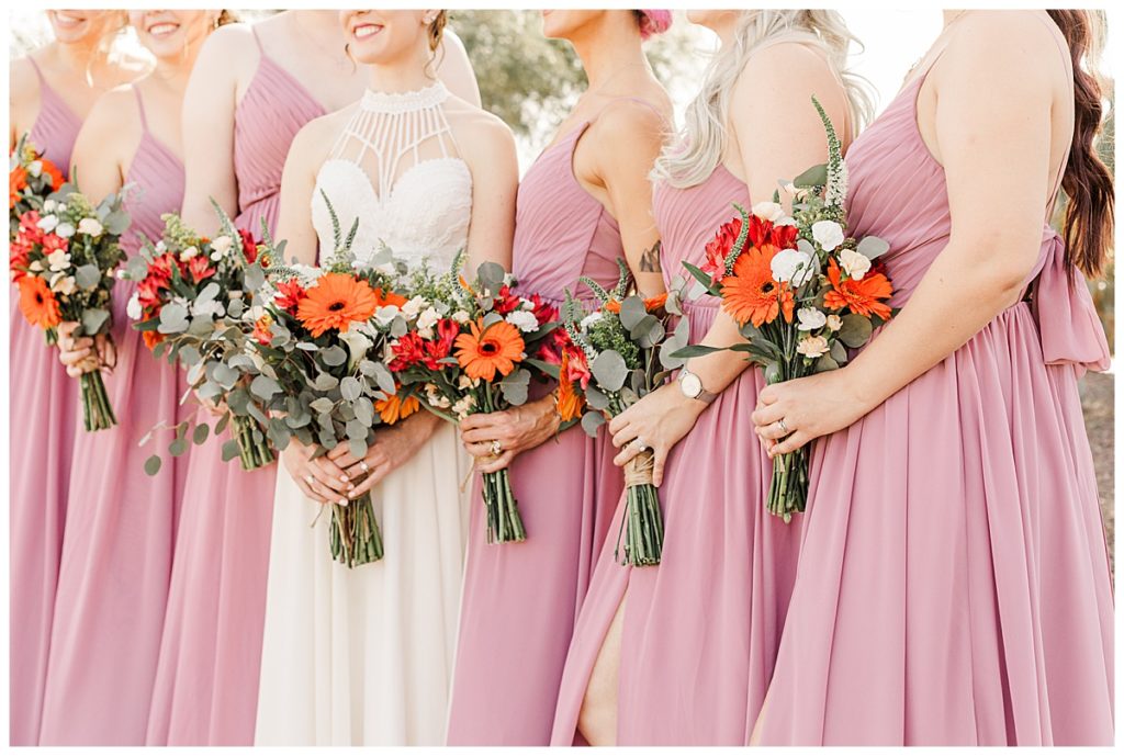 Bride with her bridesmaids and their bouquets the Golf Club at Johnson Ranch Wedding