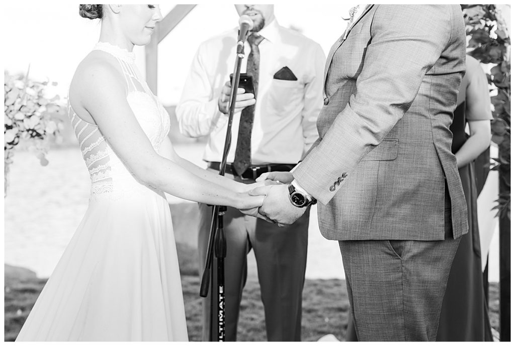 Bride and groom holding hands at Natalie & Steven's Wedding Ceremony at the Golf Club at Johnson Ranch Wedding | Gilbert, Arizona