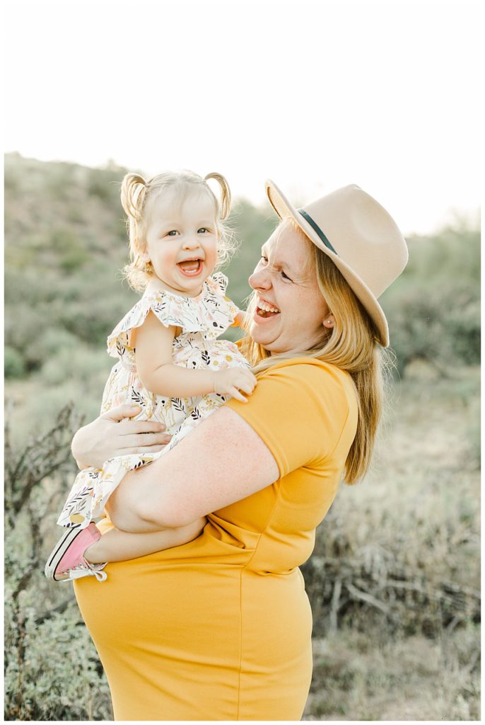 Mom and daughter laughing together, The Myler's Arizona Desert Maternity Session